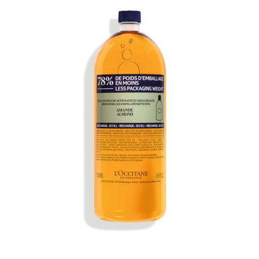 L'Occitane bottle with orange liquid on a white background