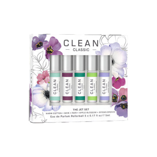 Set of Clean eau de parfum rollerballs in a decorative box with floral designs.