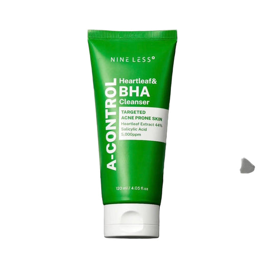 Green tube of Nine Less A-Control Heartleaf & BHA Cleanser on a gray background